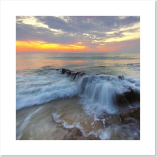 sunset waves on rocks Posters and Art